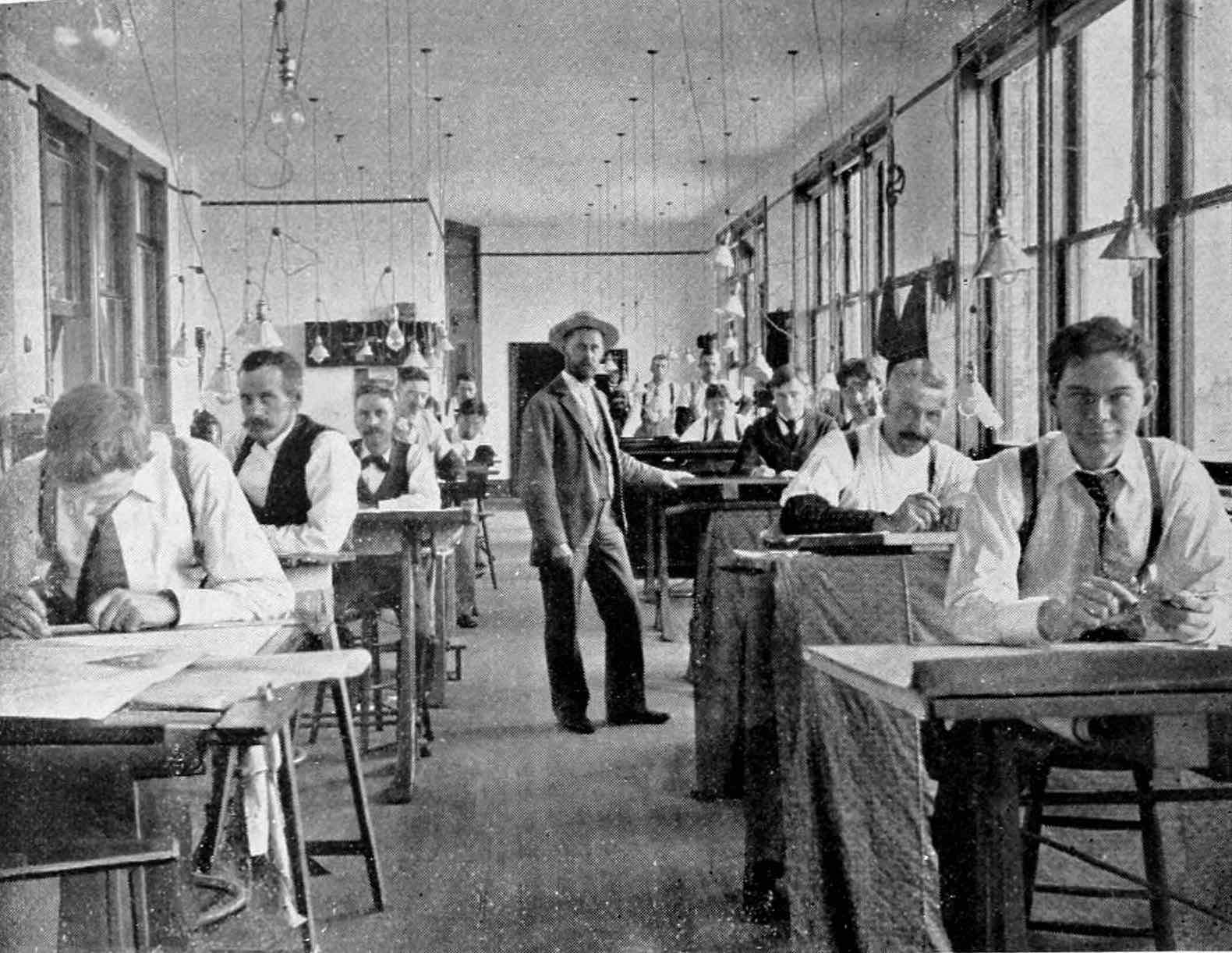 The drafting room at Gates Iron Works, 1896. A message from Snags in Microsoft Teams to Roger: a contract approval, waiting 6 days.